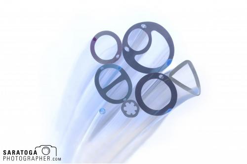 Close up view of seven different nylon tubing medical devices photographs from end on